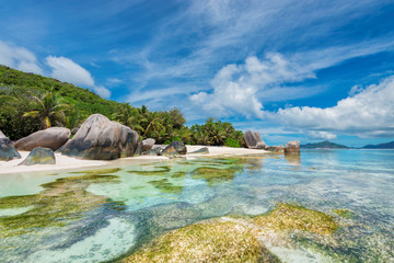 Fototapeta na wymiar Beautiful beach with granite rocks in paradise La Digue island, Seychelles/