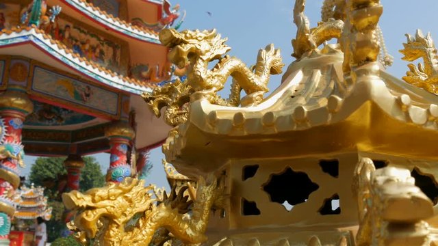 Golden statue of the Chinese dragon in the temple complex. Ornament and decoration in Chinese temple