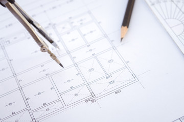 Desk work table architect with drawing home plan building and stationary in home office includes copyspace for add text or graphic