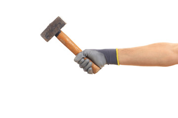 Gloved hand holding an old hammer isolated on white background