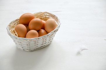 Basket with beige eggs