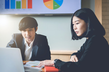 Business team analyzing income charts and graphs with modern laptop computer. Business analysis and strategy concept. vintage tone