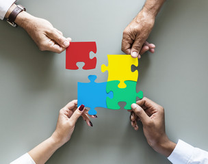 Business teamwork cooperation jigsaw isolated