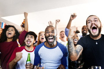 Friends cheering sport at bar together