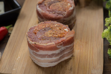 raw pork tenderloin medallions filled with chorizo sausage and wrapped with bacon