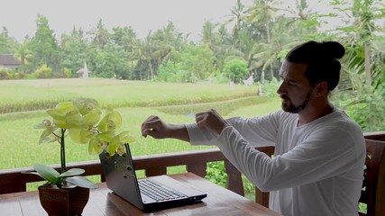 Tourism blogger posting travel tips, typing on laptop