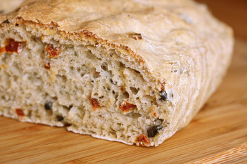 selfmade bread with tomata and olives