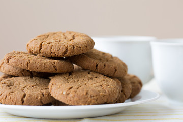Healthy breakfast with oatmeal cookies or oatcakes and cup of tea or coffee
