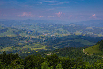 Outstanding landscape from air point of view. Green forest and the mountains are against the sky