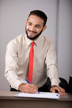 smiling while writing
