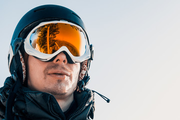 yellow ski goggles and snowboarder in the mountains