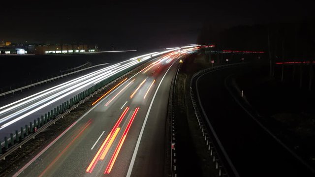 Time lapse traffic at night, highway junction in Krakow, Poland