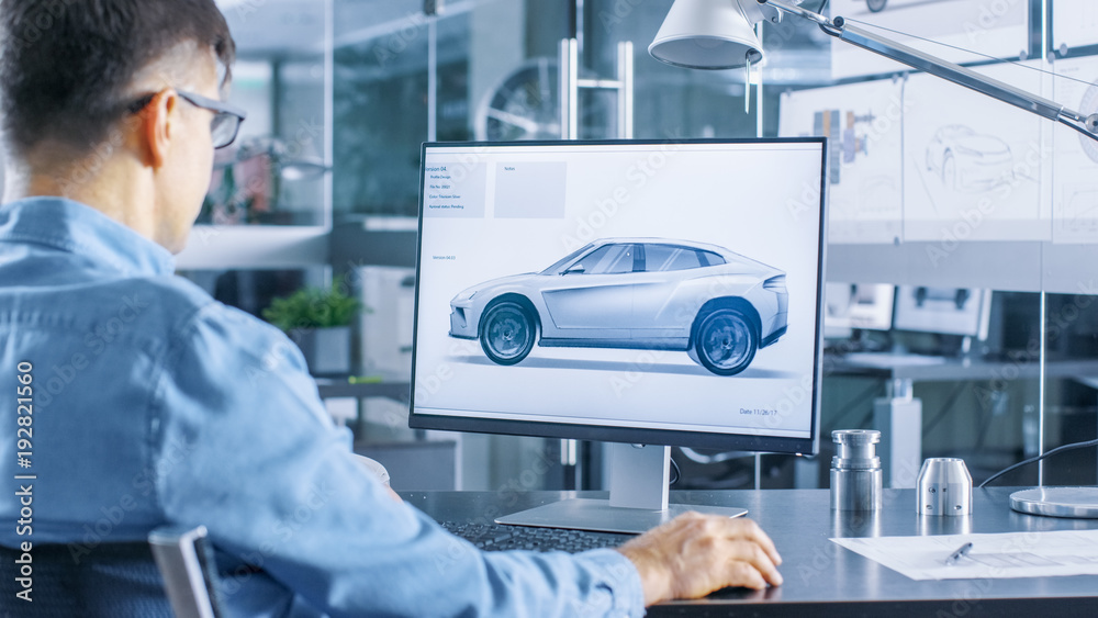 Poster automotive engineer works on the personal computer, he perfects new car model prototype sketch. he w