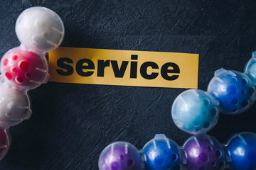 Cleaning house or office concept. Toilet refreshing block, SERVICE inscription on a dark concrete...