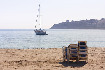 Mallorca beach with stack of sun loungers