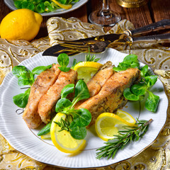Fried carp fillet on wintry salad