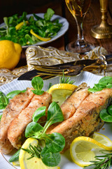 Fried carp fillet on wintry salad