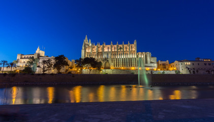 Palma de Mallorca Cathedral sunset. Night lighting reflected in water. Balearic islands of Spain