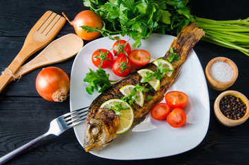 Fried fish served on the plate