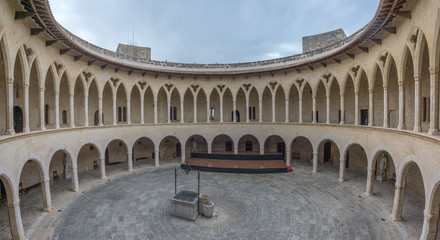 Fototapeta na wymiar Colonnade of Bellver castle, Palma of Mallorca, Spain. Circular outdoor patio