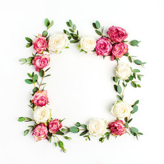 Floral frame wreath made of red and white rose flowers and eucalyptus branches. Flat lay, top view...