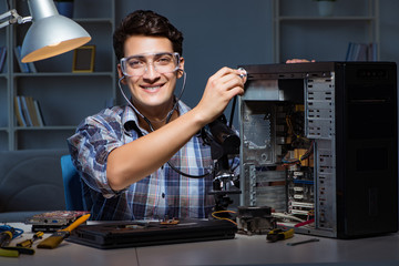 Computer repair concept with man inspecting with stethoscope