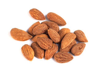heap of brown roast almonds on white background