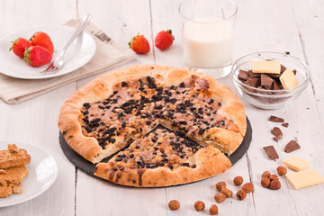 Sweet chocolate pizza with cookies. 