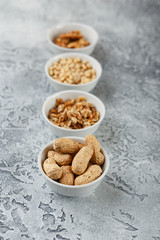 Different nuts on gray background