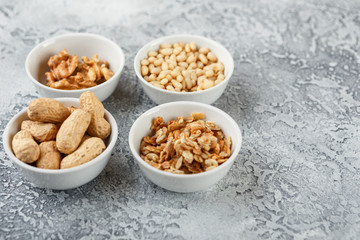 Different nuts on gray background