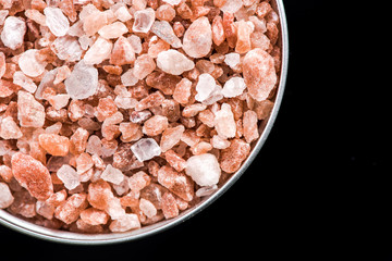 Fototapeta na wymiar Himalayan salt cristals seeds in pot with copy space
