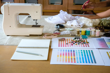 equipment on fashion designer desk in studio. design thing in atelier
