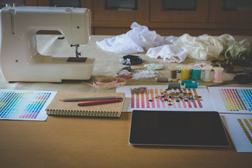 equipment on fashion designer desk in studio. design thing in atelier