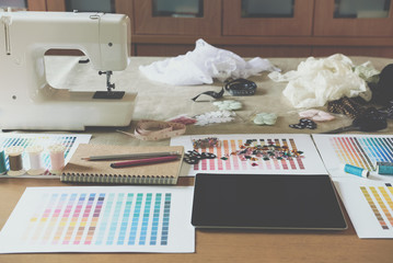 equipment on fashion designer desk in studio. design thing in atelier
