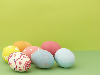 Easter eggs on green background