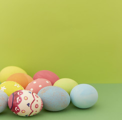 Easter eggs on green background