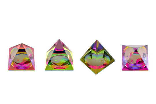 Jin jang glass colored pyramid stock images. Set of colored pyramids stock images. Positive energy ornament. Rainbow jin jang colored pyramid