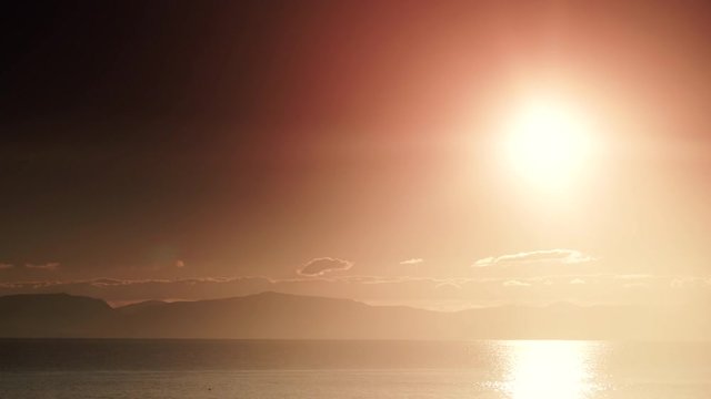 Scenic sunrise sun rising over sea surface, Greece Peloponnese, time lapse