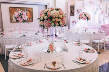 Wedding bouquet on the table with cutlery