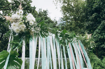 Fototapeta premium Wedding arch on a green glade.