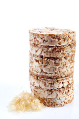 Round wheat crispbread, white background. Composition of crispbread on white background.