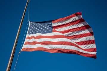 Naklejka premium American Flag Flying at Half Mast
