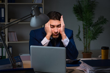 Employee working late to finish important deliverable task