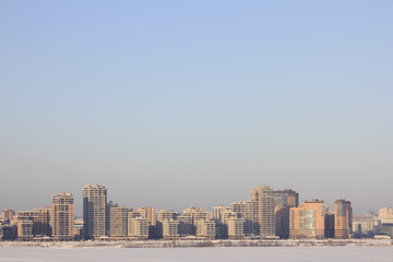 Urban landscape of a residential block the view across the river in the winter