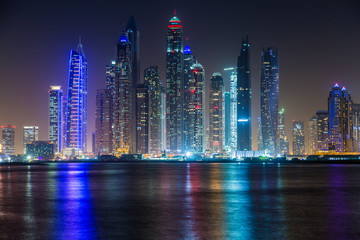 Scenic view of Dubai Marina Skyscrapers, night skyline, View from Palm Jumeirah, United Arab Emirates.