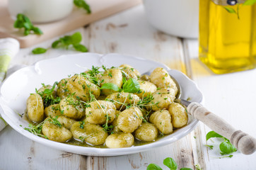 Pesto gnocchi, garlic and fresh herbs olive oil