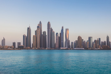 Fototapeta na wymiar Scenic view of sunset over Dubai Marina Skyscrapers, View from Palm Jumeirah, United Arab Emirates.