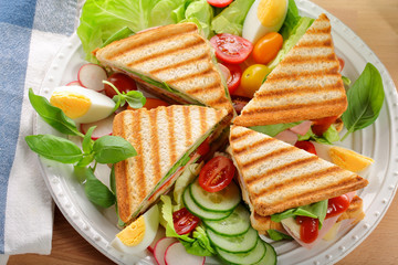 Fresh sandwiches salad on wooden background