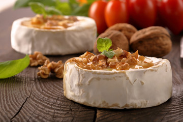 Grilled brie cheese with honey and nuts