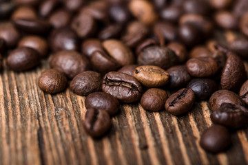 fried coffee beans. coffee beans, on a wooden background